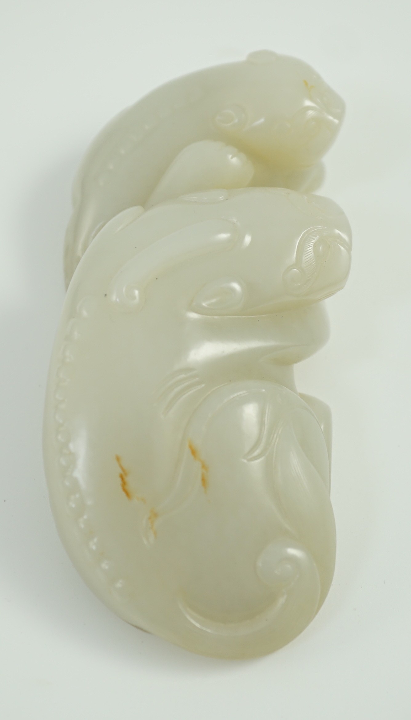 A Chinese white jade mythical beast group, 12cm long